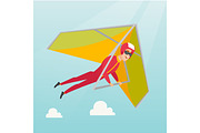 Young caucasian man flying on hang-glider.