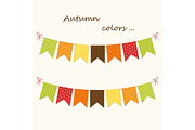 Cute autumn bunting flags with letters in traditional colors