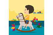 Boy riding toy horse in kindergarten