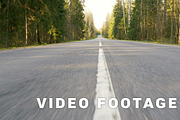 Road between forest - flying camera shot