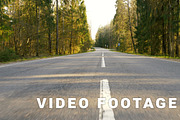 Road between forest - flying camera shot