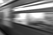 Diagonal black and white motion blur metro train background