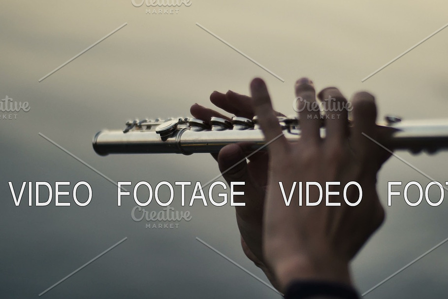 closeup of flutist playing in the sunset near water in Graphics - product preview 8