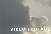 Skydiver landing with two parachutes - slowmotion 60fps
