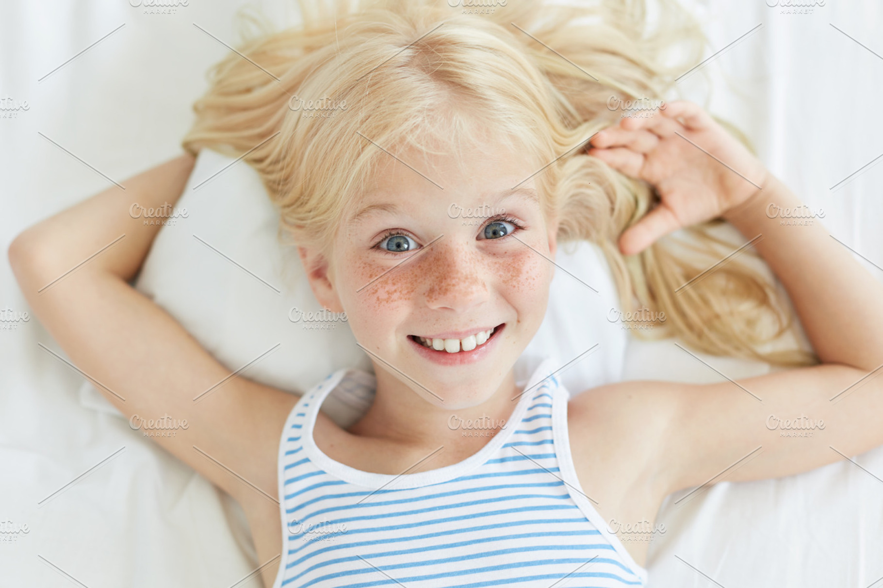 Cute Little Female Child With Blonde Hair Blue Eyes And Freckled