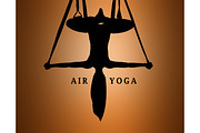 The silhouette of Young woman doing anti-gravity aerial yoga