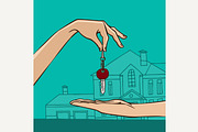 Hand holding house key