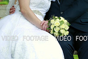 beautiful wedding bouquet in the hands of the bride and groom