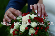 beautiful wedding bouquet in the hands of the bride and groom