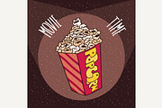 Cardboard box with popcorn in beams spotlights
