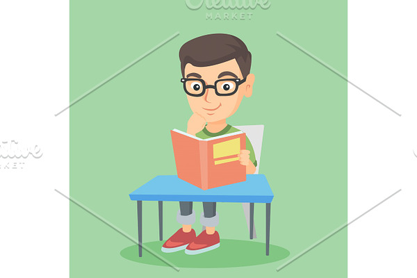 Student sitting at the table and reading a book.