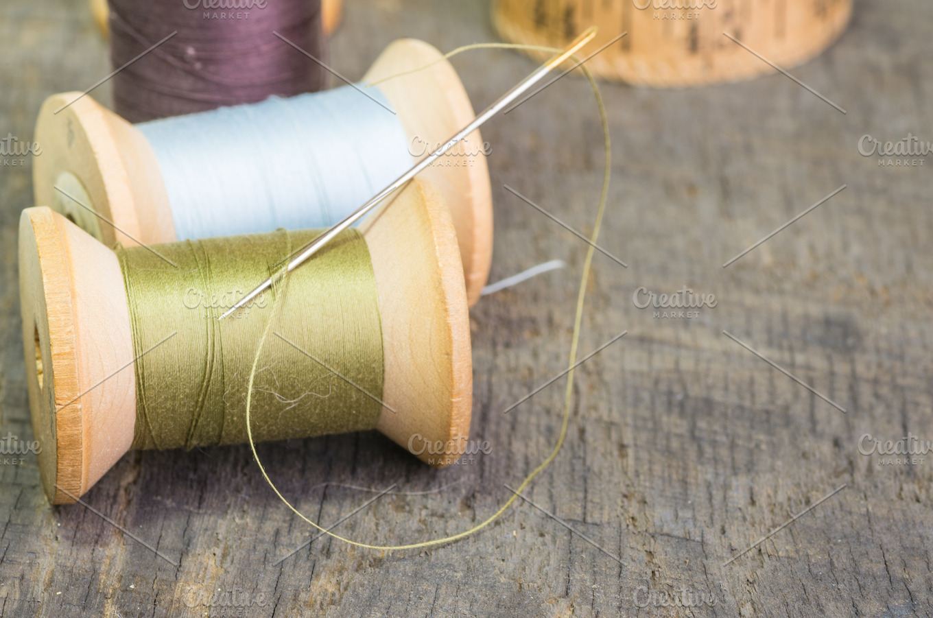 Spools of thread with needle | High-Quality Beauty & Fashion Stock ...