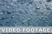 Bubbles underwater background in slow motion