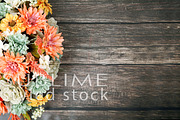 Fall flowers on a wood background