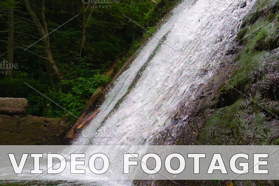 Mountain river waterfall in slow motion