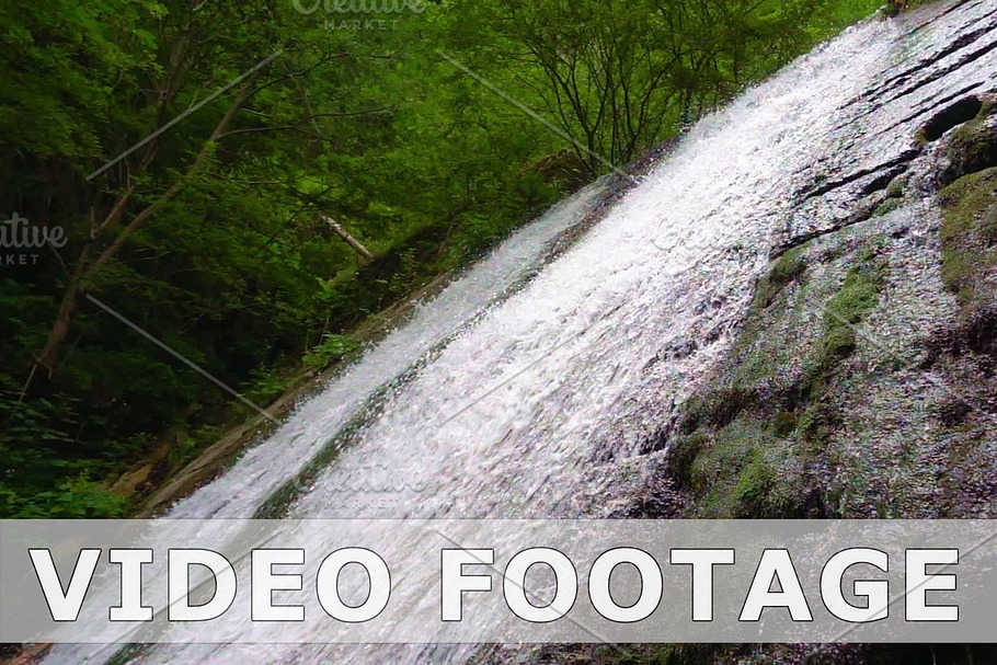 Mountain river waterfall in slow motion
