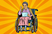 elderly woman disabled person in a wheelchair, gadget tablet