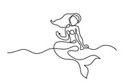 Mermaid sitting on beach