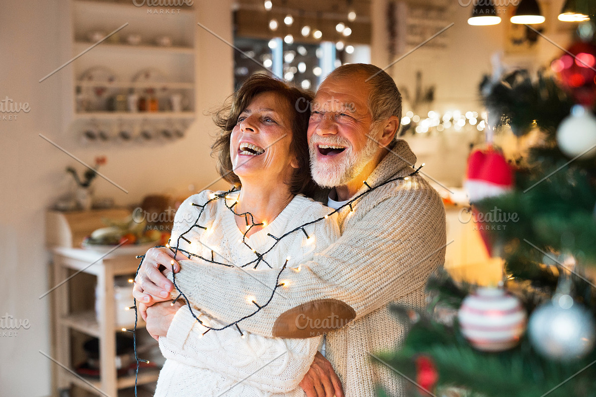 Senior couple hugging at home at Christmas time. in Graphics - product preview 8