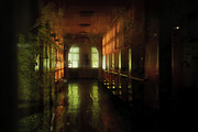a dark hallway in the hospital, illuminated by the light from the lantern