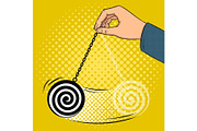 Hypnotizer pendulum in hand pop art vector