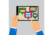 Hands holding tablet with restaurants map