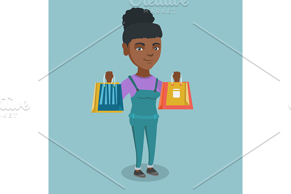 Young african-american woman holding shopping bags