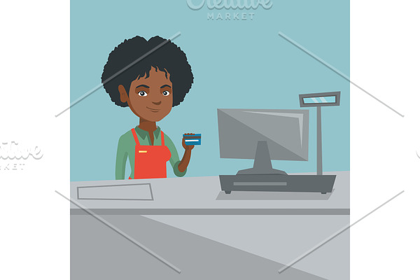 Young african-american cashier holding credit card