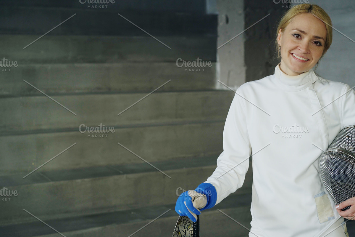 Portrait of young fencer woman smiling and looking into camera indoors in Graphics - product preview 8