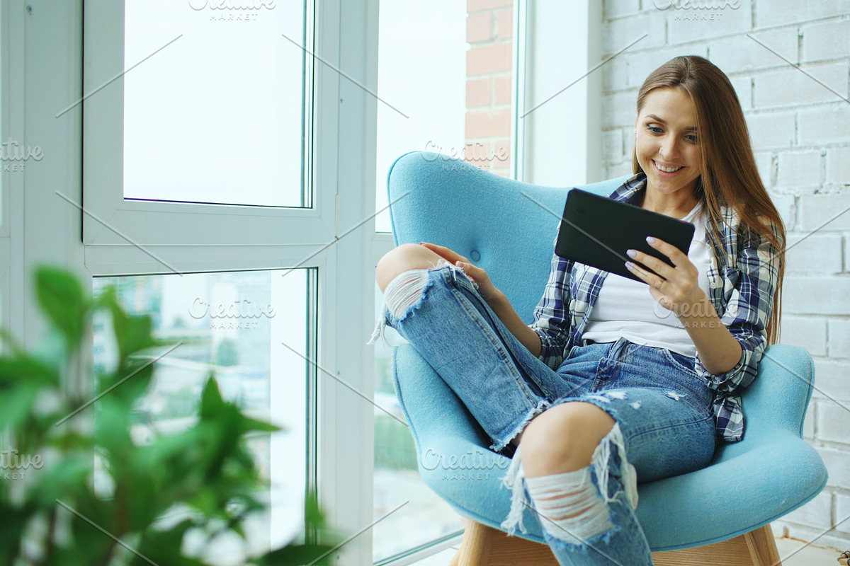 Young happy woman have online video chat using digital tablet computer sitting on balcony in modern loft apartment in Graphics - product preview 8