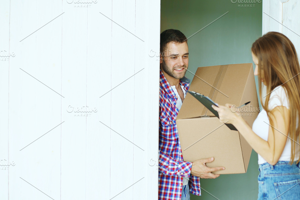 Young man deliver cardboard box to customer at home. Woman sign in clipboard for receiving parcel in Graphics - product preview 8