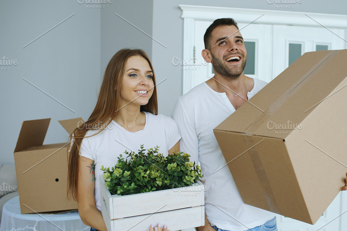 Young happy couple talking while standing at their new house in Graphics - product preview 8