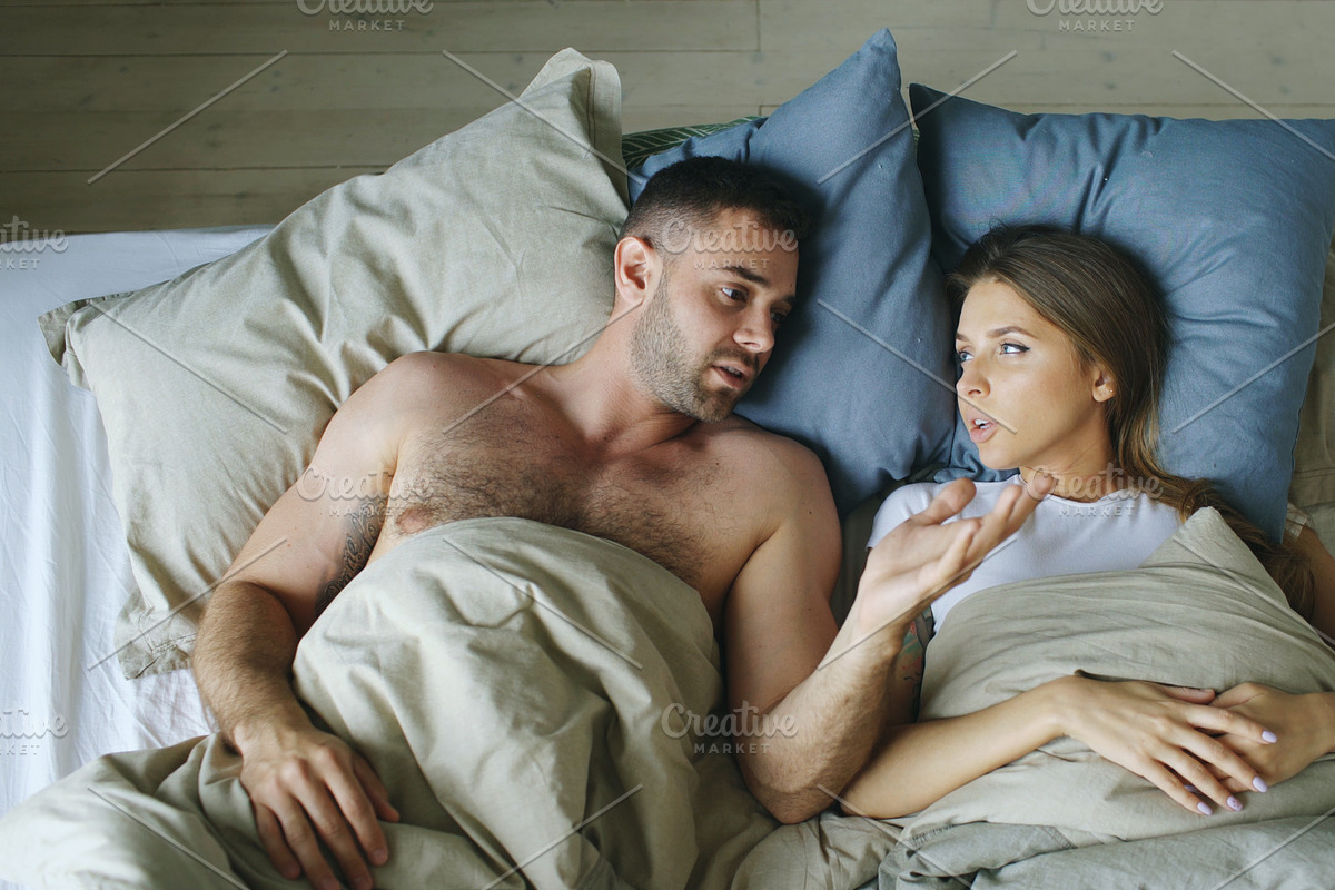 Top view of young couple lying in bed upset and argue each other in Graphics - product preview 8