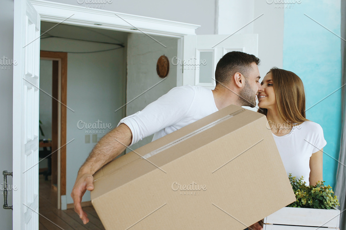 Young happy couple walking into new house after moving day and kiss each other in Graphics - product preview 8