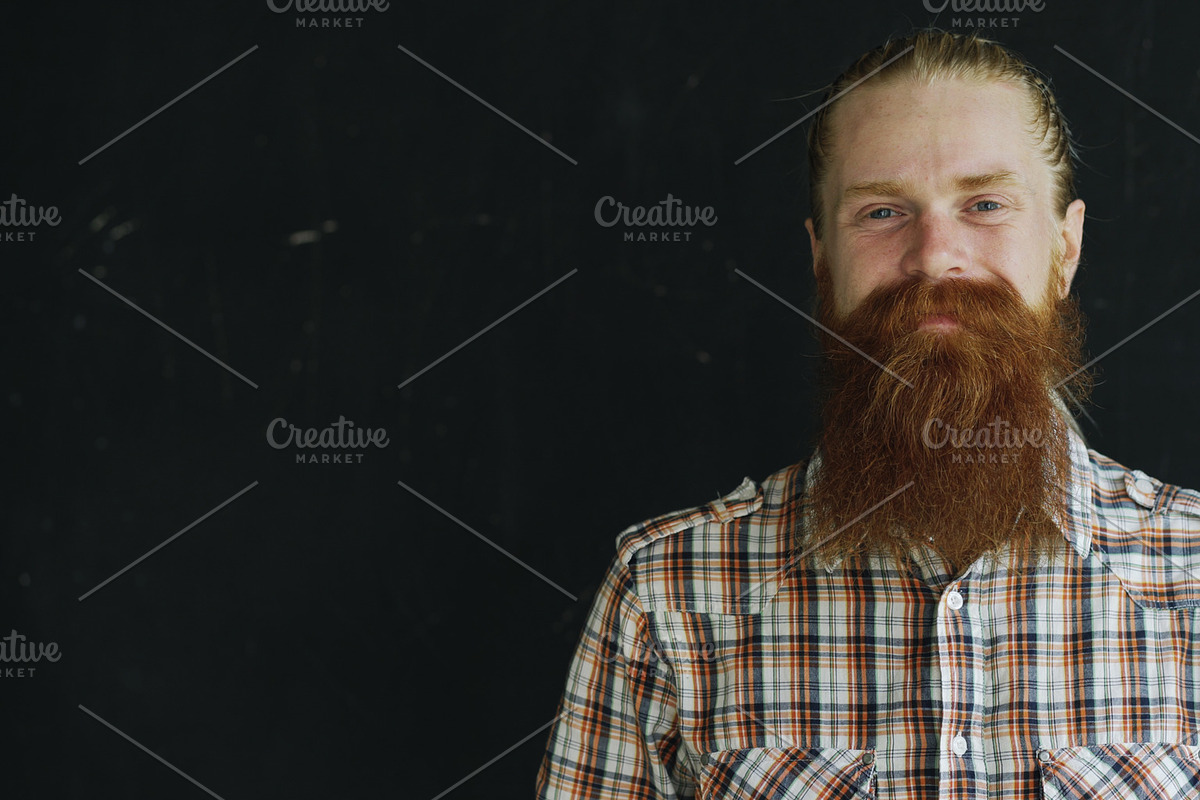 Closeup portrait of hipster man looking at camera and smiling on black background in Graphics - product preview 8