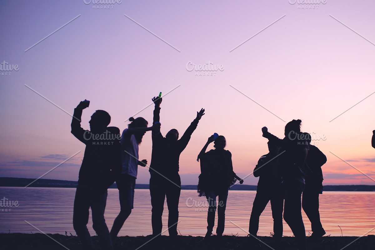 Silhouette of Group young dancing people have a party at beach on sunset in Graphics - product preview 8