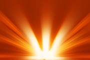 Diagonal orange blast of sunlight rays background
