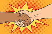 Handshake black and white, African and Caucasian people