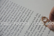 Wedding rings on the book page