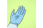 Hand of scientist in glove pop art vector