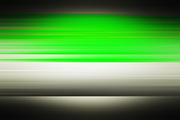 Green motion blur on grey backdrop