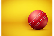 Cricket ball on bright orange background