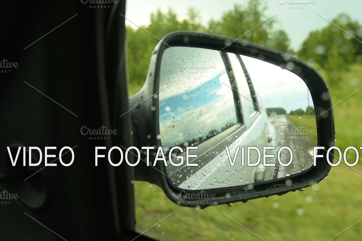 Side mirror view of car driving in the countryside on rainy day in Graphics - product preview 8