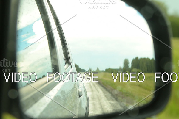 Side-view mirror of driving car