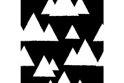 Seamless pattern with geometric snowy mountains. White triangles and black background.