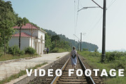 Young girl walks on the railway. Georgia