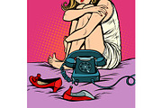woman sitting at a retro phone