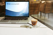 Modern laptop and coffee cup a