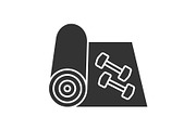 Training mat with dumbbells glyph icon