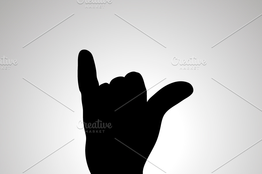 Silhouette of hand in shaka gesture